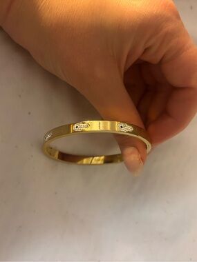 Gold hand eye bangle